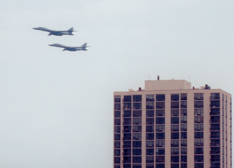 Two B1s flying past an apartment block