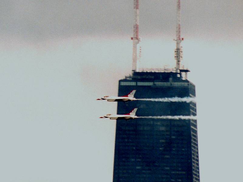 photo #606:  two Thunderbirds pass top of Hancock building