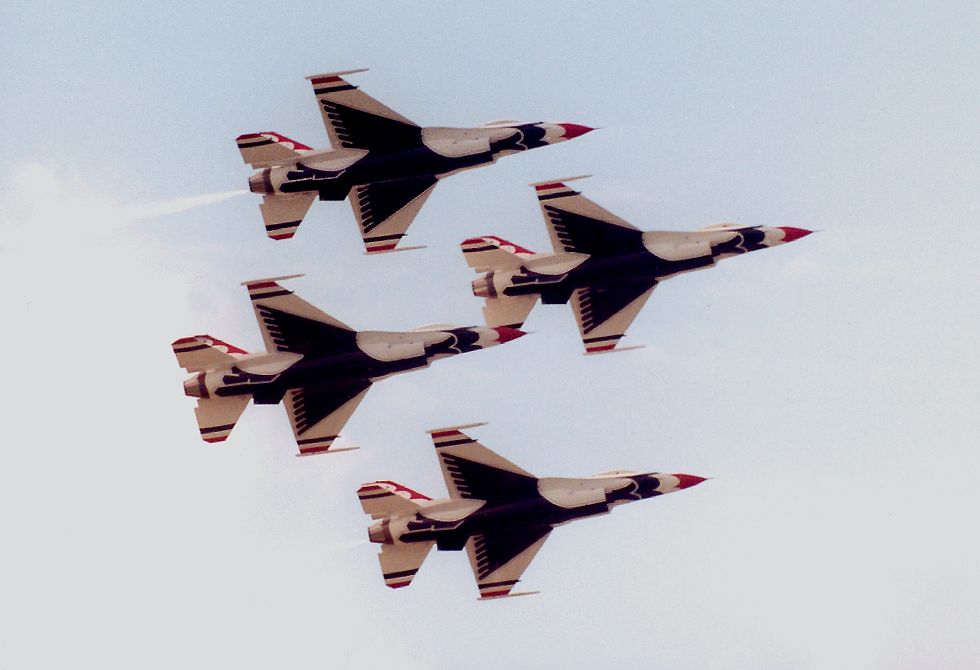 photo #51: four Thunderbirds in tight formation against blue sky