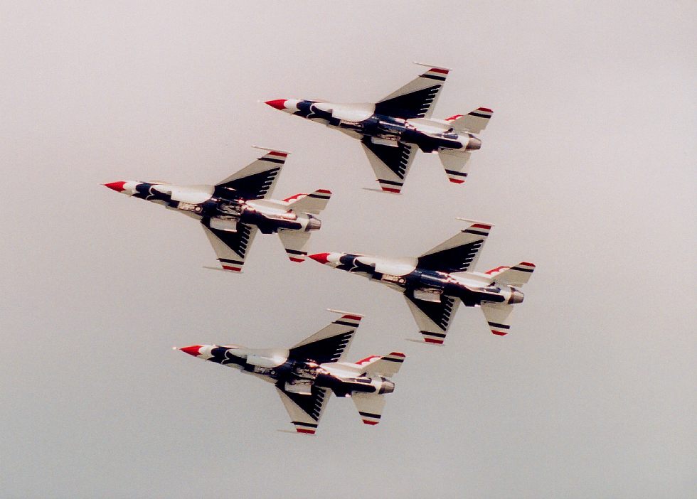 photo #54:  four Thunderbirds banking in tight formation while pulling wheels up