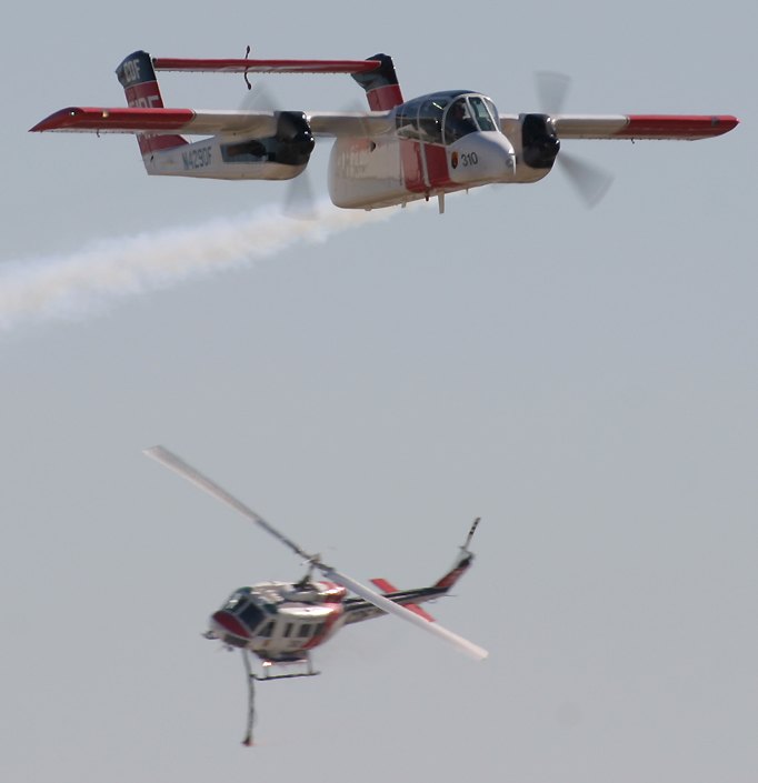 OV-10 Bronco and UH-1 Iroquois during a fire fighting demonstration