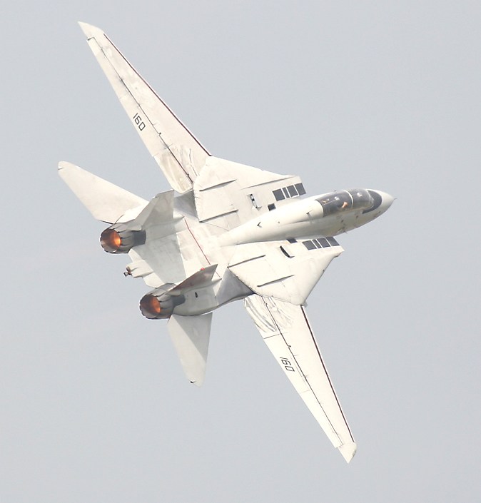 retro F-14 banking with wings extended