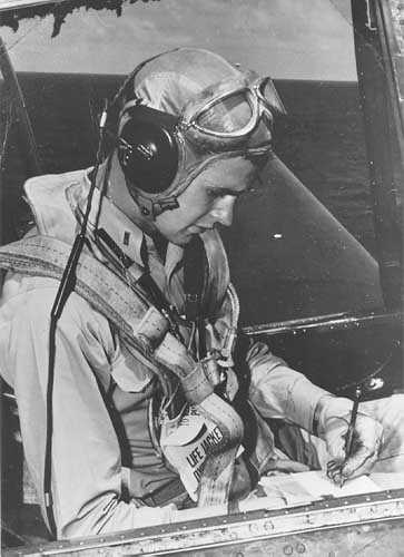 George Bush sitting in the cockpit of his Avenger during WW 2.