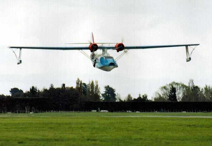 Catalina doing a very low-altitude pass with pontoons lowered