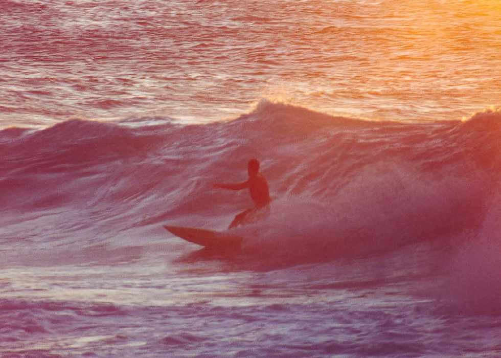 surfer surrounded by the sun's glow