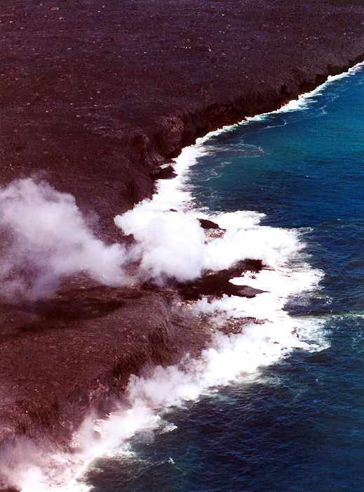 steam rising as lava hits the ocean