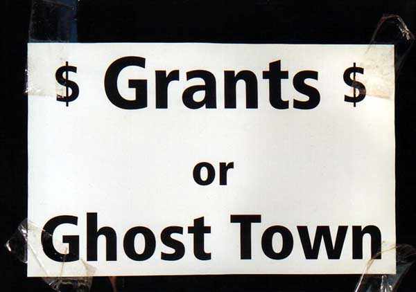 sign saying 'Grants or Ghost Town'