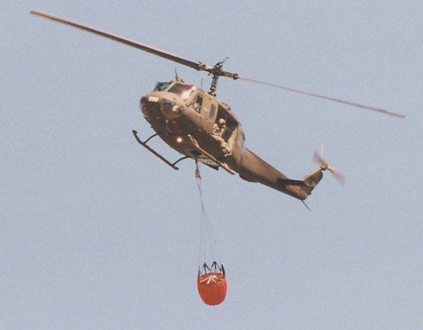 Huey with monsoon bucket and guy hanging out