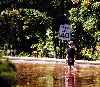 kid walking down flooded Canal Road